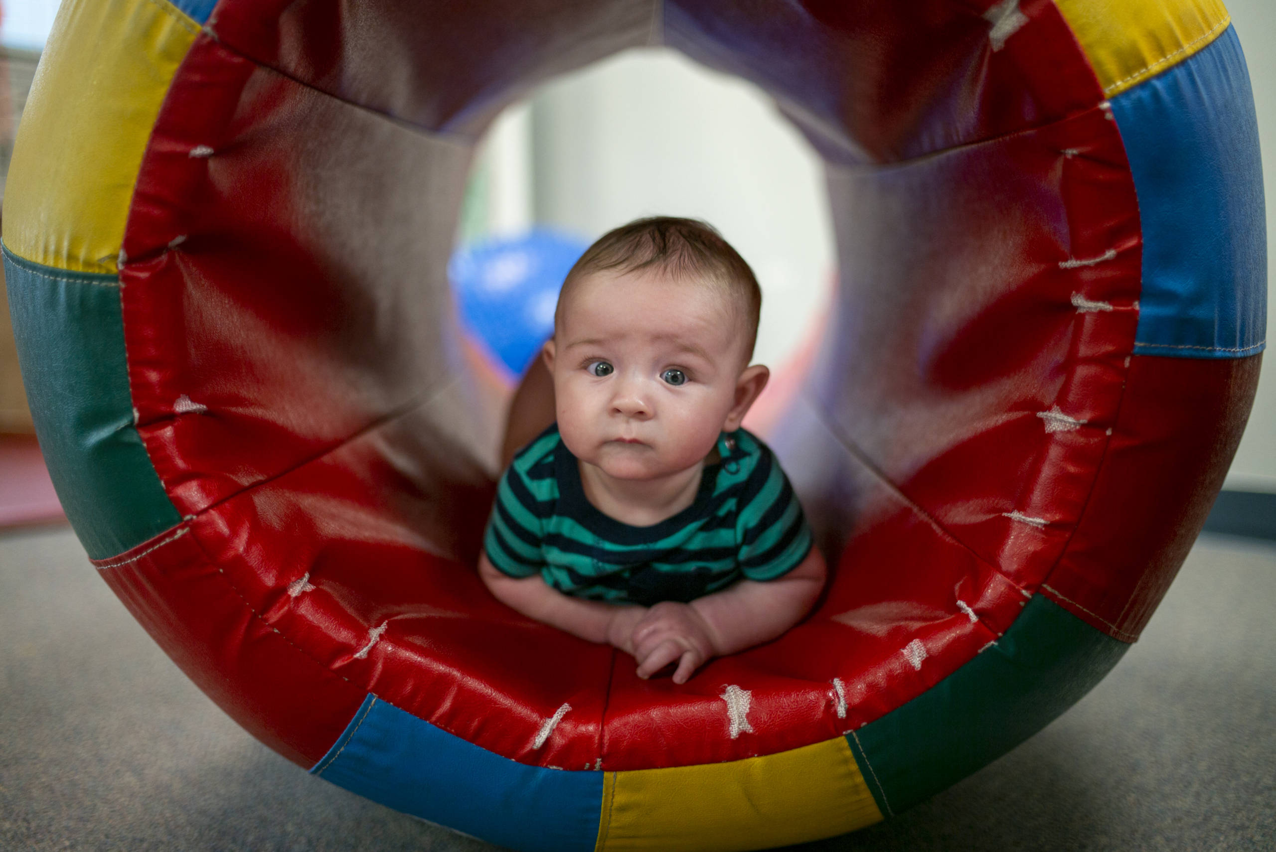 Baby on a rolled play mat